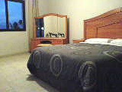 Bedroom at Knightsbridge Holiday Apartments